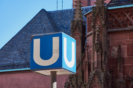 blue and white underground sign in Frankfurt City, Germanyの写真素材