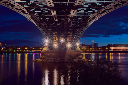 under the Theodor-Heuss bridge in Mainz with view to Mainz during blue hourの写真素材