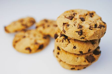 pile of chocolate cookies against white background with copy spaceの写真素材