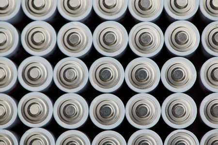 macro photo of batteries with the positive poles close up, background photoの写真素材