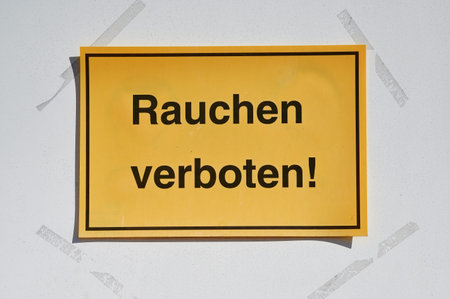 yellow sign with German text which means smoking forbidden