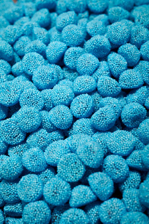 close up of blue gummy bears as background photo, frame filling