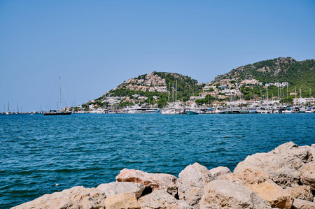 Alcudia, Mallorca - August, 17, 2021: cityscape and harbor of Alcudia, Mallorca, Spain on a sunny and cloudless dayのeditorial素材