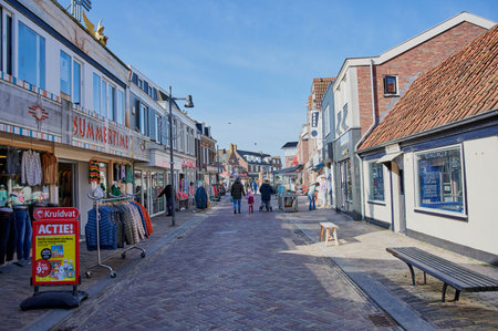 Egmond aan Zee, Netherlands - April 05, 2023: shopping street to the beach at Egmond aan Zee in the...