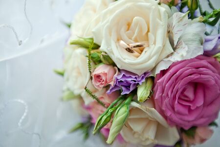 Bridal bouquet of roses and ringsの写真素材