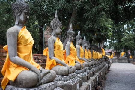 Buddha statue in yellow clothの写真素材