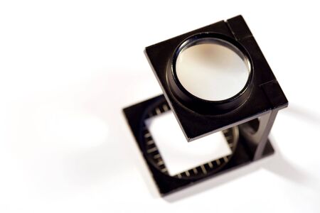 Shallow depth of field image of a Printers loupe on white background.の写真素材