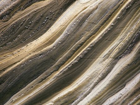 Background / textural image of a rock wall eroded by rain water.の写真素材