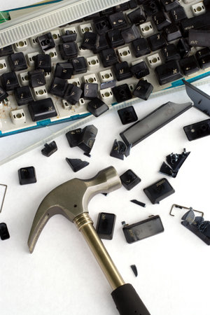 An image of computer frustration. I bashed my keyboard with a hammer, then took pictures.の写真素材