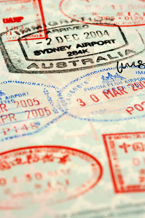 Macro / selective focus image of passport stamps.  Focus is on the word Australia.の写真素材