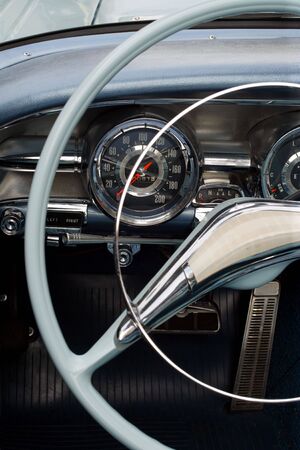 The steering wheel and dashboard of an antique classic car.の写真素材