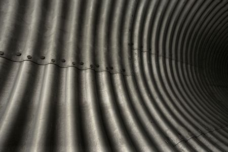 An abstract image of steel plate used for tunnels.の写真素材