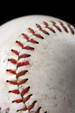 A background macro image of a old worm baseball.