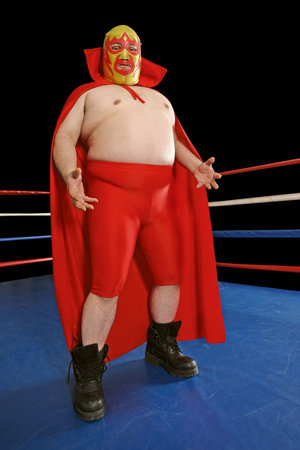 Photograph of a Mexican wrestler or Luchador standing in a wrestling ring.の写真素材
