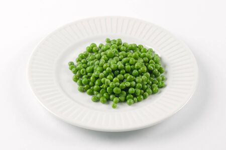 Photo of a plate of green peas.の写真素材
