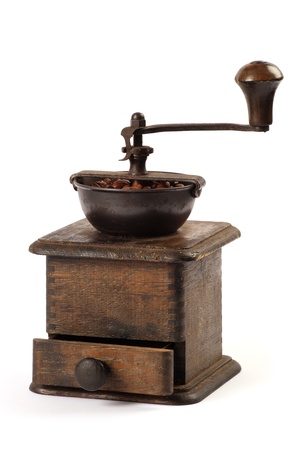 Photo of an antique coffee grinder isolated on a white background.の写真素材