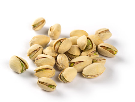 Macro photo of a small group of pistachios on a white background 