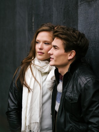 Photo of a happy couple in love outdoors during autumn.  Shallow depth of field with focus on the woman. Photo is from the PhotoWalk in Berlin during Microstock Expo.の写真素材