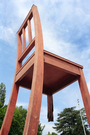 GENEVA, SWITZERLAND ? June 9, 2010 ? Photo of the Broken Chair wooden sculpture standing across the street from the Palace of Nations. It symbolizes an opposition to land mines.のeditorial素材