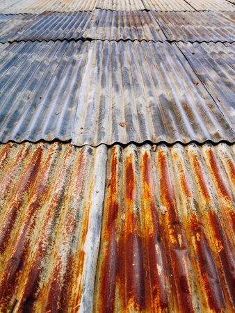 Photo of a rusty corrugated metal roof at an angle.の写真素材