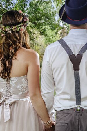Cropped photo of a beautiful couple from behind on their wedding day.の写真素材