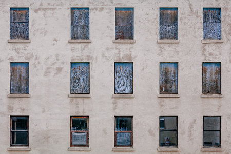 Boarded up windows from an abandoned building in the USA.