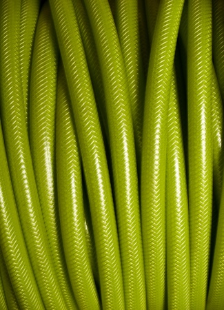Rolled up of green PVC garden hose の写真素材