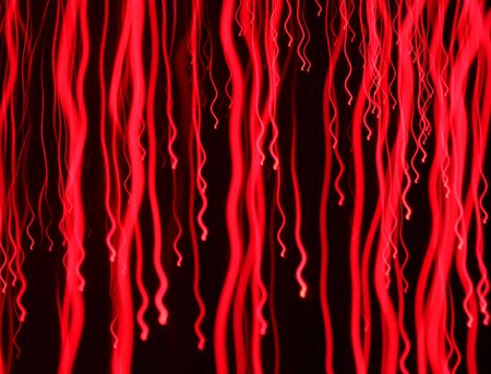 A rain of blurry red lights intentionally out of focus and movedの写真素材