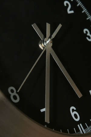 cropped shot of wallclock with all three dials in 8, 7 and 6 の写真素材