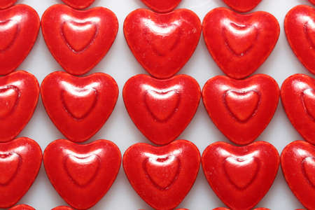 A close up of very red heart shaped candiesの写真素材