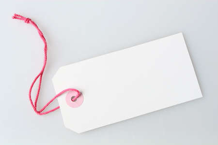 a blank white label tag with string attachedの写真素材