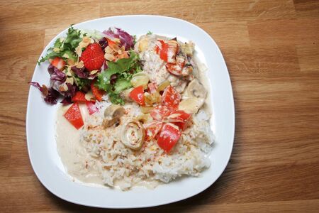 plate of ready to eat chicken with rice and saladの写真素材