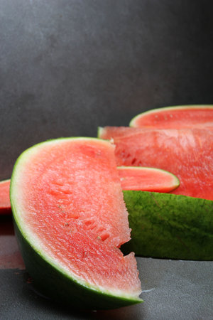 cut watermelon on a darkgrey background