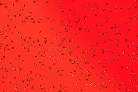 bubbles in water shot on red background,の写真素材