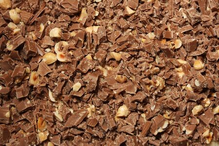 chopped chocolate with nuts, frame filling, great as backgroundの写真素材