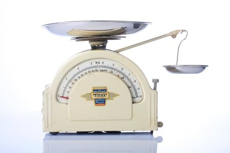 vintage kithcen scale, isolated on whiteの写真素材