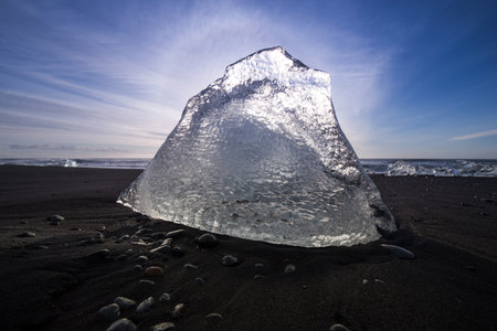 Ice block from Jokulsarlon melting slowly on Breidamerkursandur beach