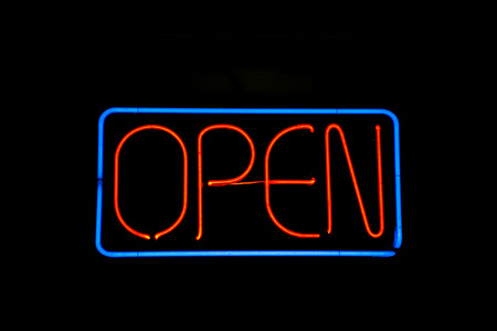 Neon sign reading open on blackの写真素材