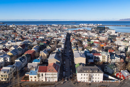 Reykjavik city overview shot from the tower of hallgrimskirkja over to the downtown area and shopping street of laugavegurの写真素材