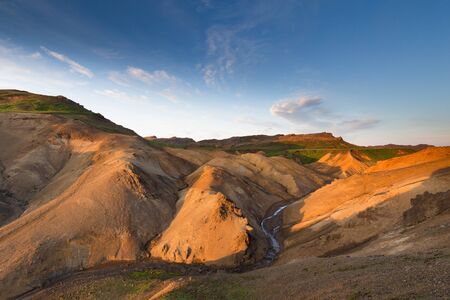 Sogin in Reykjanes peninsula Iceland, view over some small stream flowing from solfataras in the distance, fantastic colors and contrast in this landscape imageの写真素材