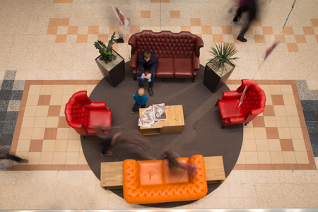 blurred shot from above of a resting area in a shopping mall.の写真素材
