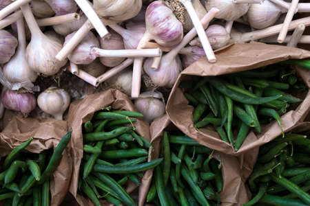 Green beans in paper bags at a farmers market after harvestの写真素材