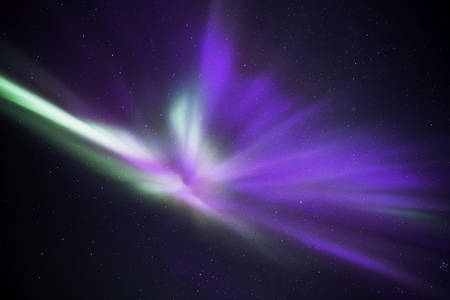 Auroras in Iceland forming an angelic shape in the nightskyの写真素材