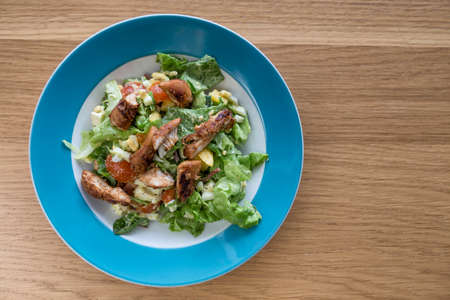 Top down view of chicken salad in a bowl with copy space to the rightの写真素材