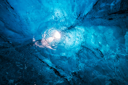 Ancient clear blue ice in an ice cave in icelandの写真素材