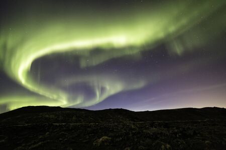 Auroras over the Reykjanes peninsula in Iceland in Aprilの写真素材