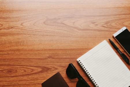 Blank notebook on wood table with men's accessories.の写真素材