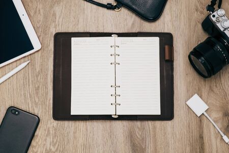 Top view of notebook ,camera ,smart phone and accessories,Travel vacation background concept.の写真素材