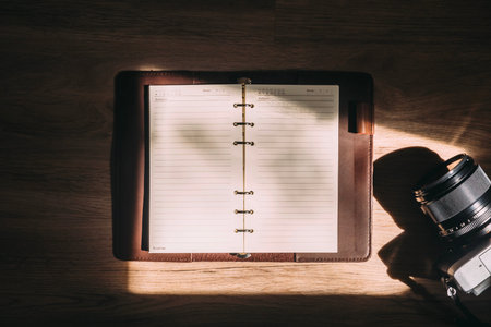 Top view of notebook and camera ,Travel vacation background concept.