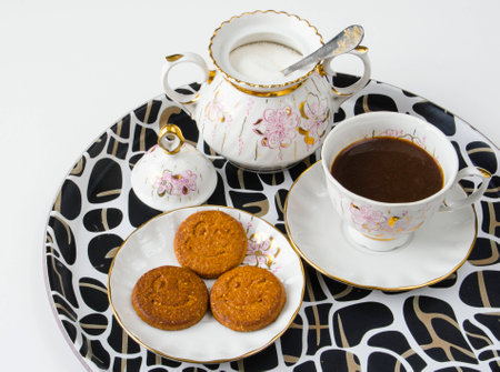 cup of coffee and biscuits on a trayの写真素材
